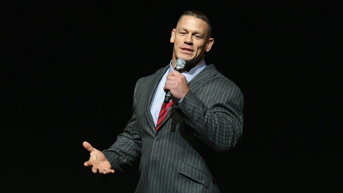 John Cena speaks at a podium during a 20th Century Fox presentation.