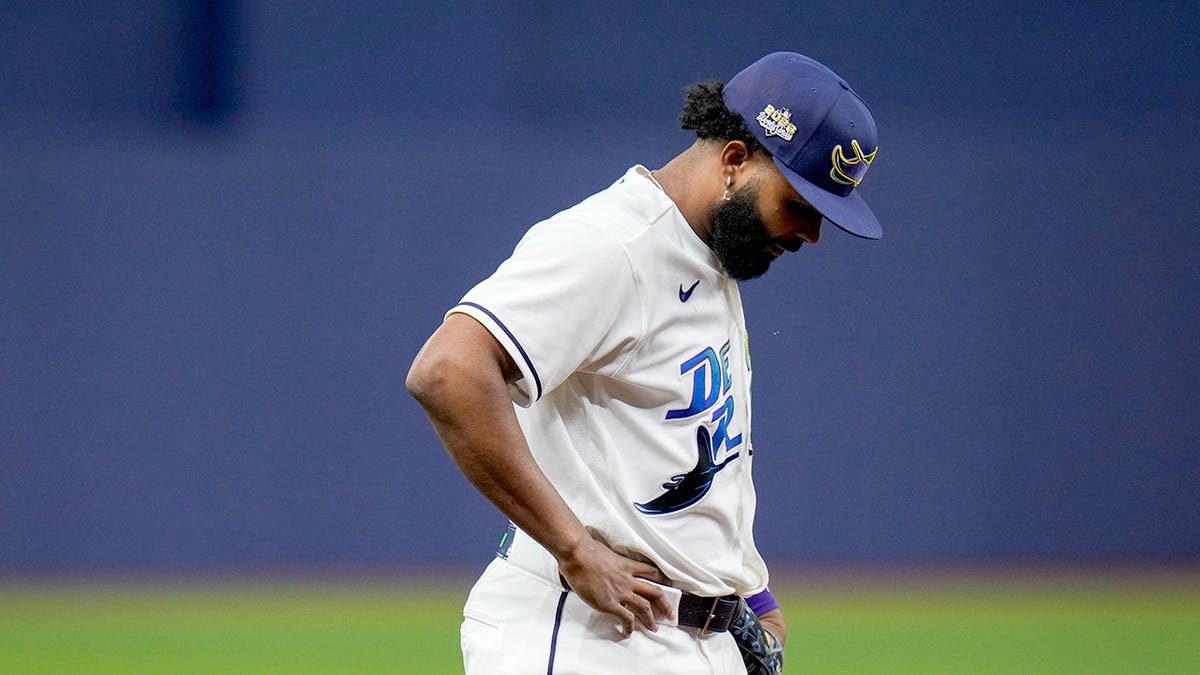 Junior Caminero looks down between hitters during Game 3 of the World Series.