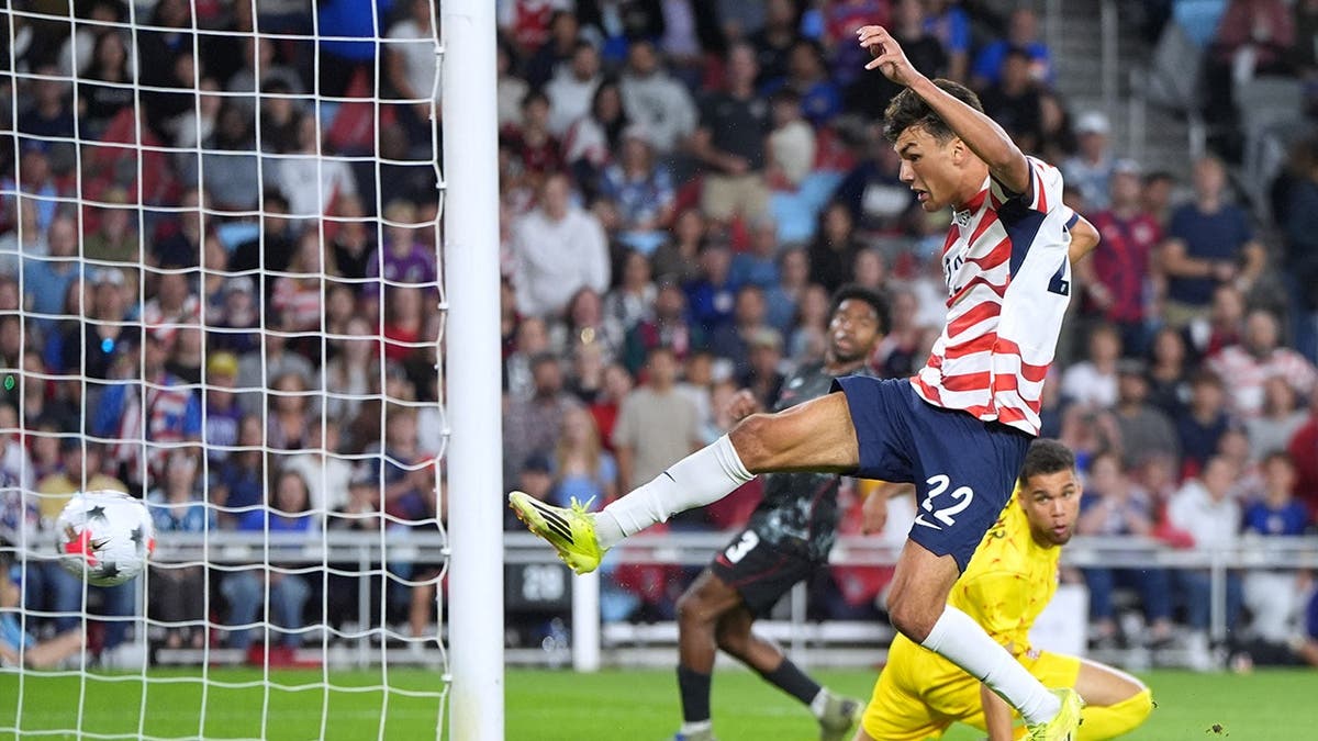 Justin Ellis scores a goal during a soccer match against Canada in St. Paul, Minn.