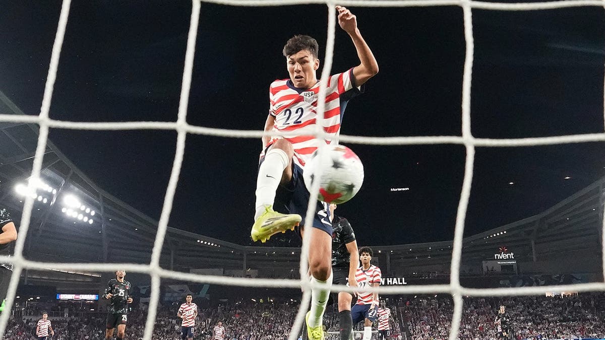 Justin Ellis scores a goal during a U.S. vs. Canada soccer match.