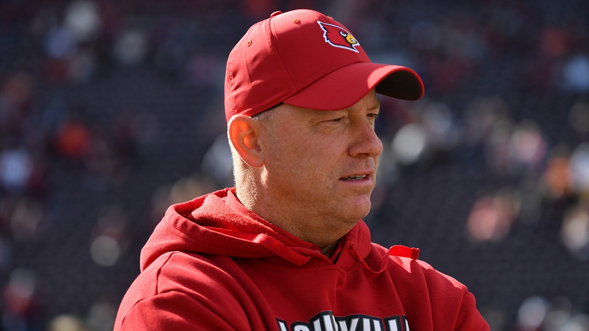 Jeff Brohm looks on before a game
