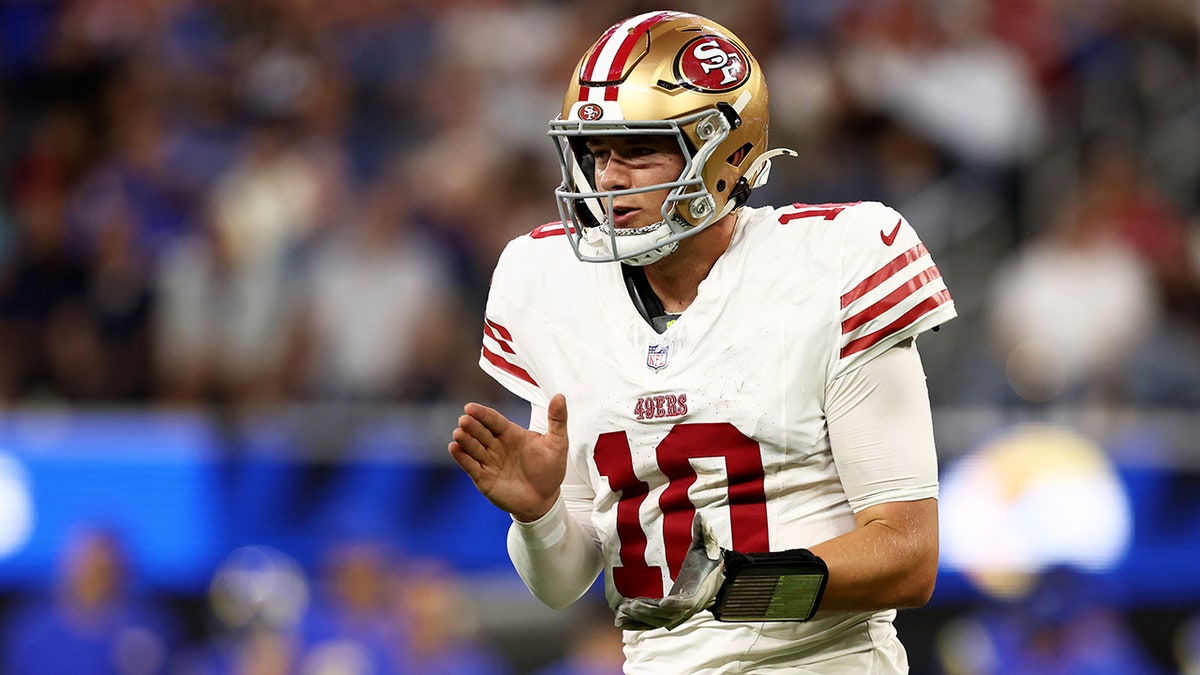 Mac Jones reacts during an NFL game