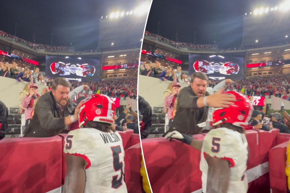 Alabama fan smacks Georgia player on helmet in stunning scene