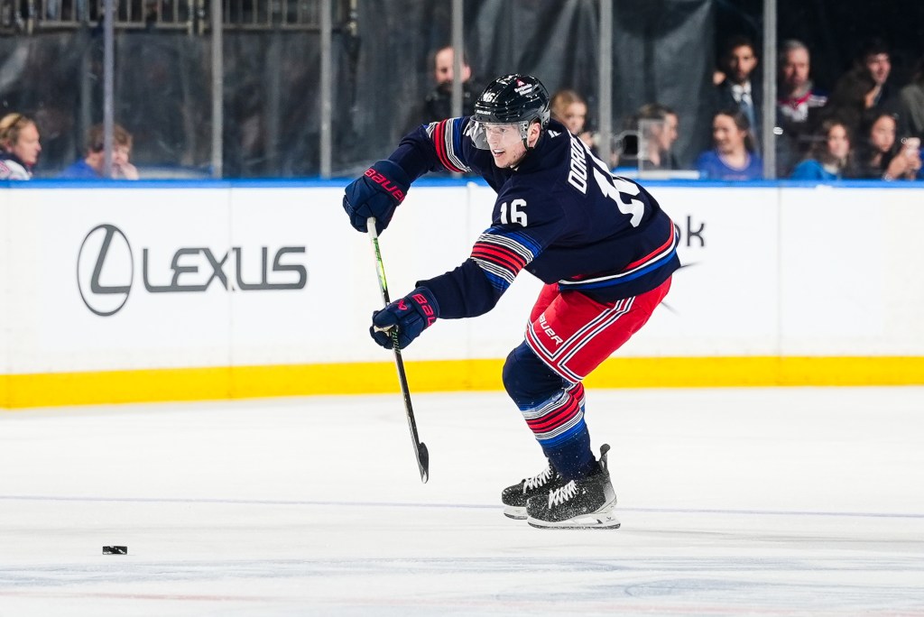 Pavel Dorofeyev of the New York Rangers passes the puck against the Vancouver Canucks.