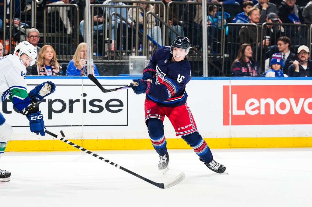 New York Rangers forward Pavel Dorofeyev takes a slapshot against the Vancouver Canucks during a game at Madison Square Garden.