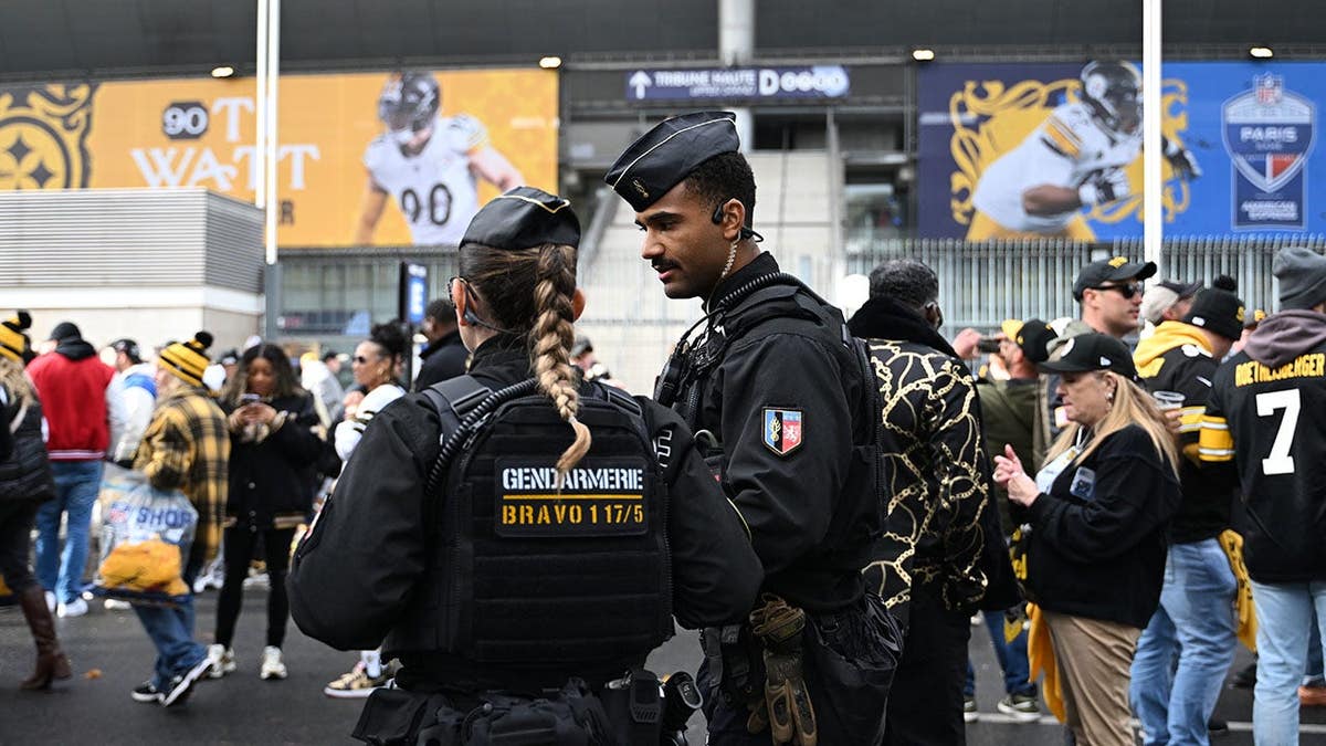 Police officers patrol outside the Stade de France stadium in Paris.