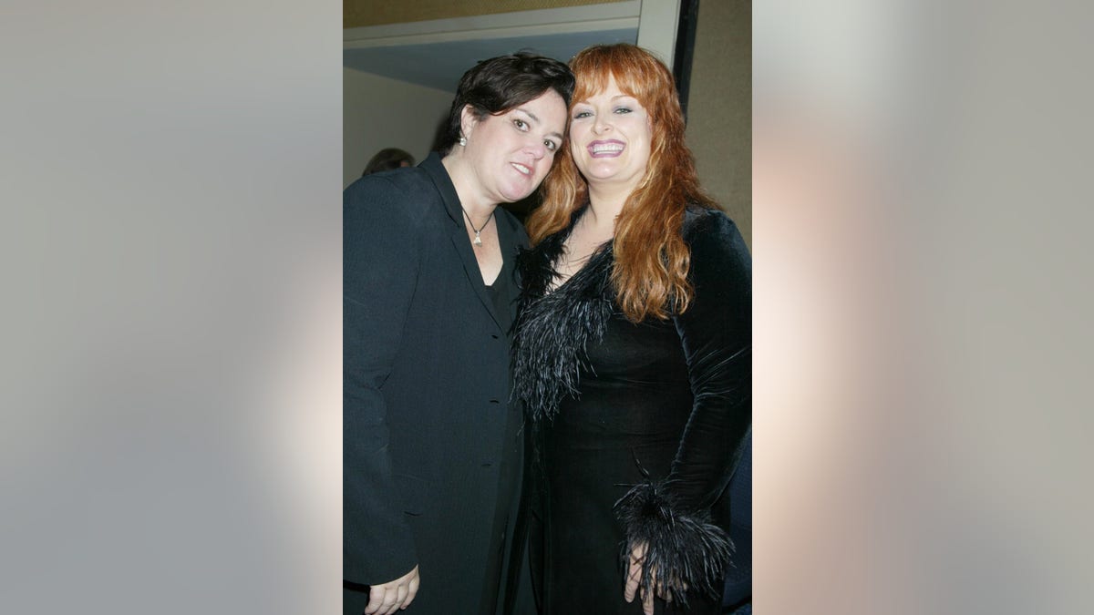 Rosie O'Donnell and Wynonna Judd posing together at an event.