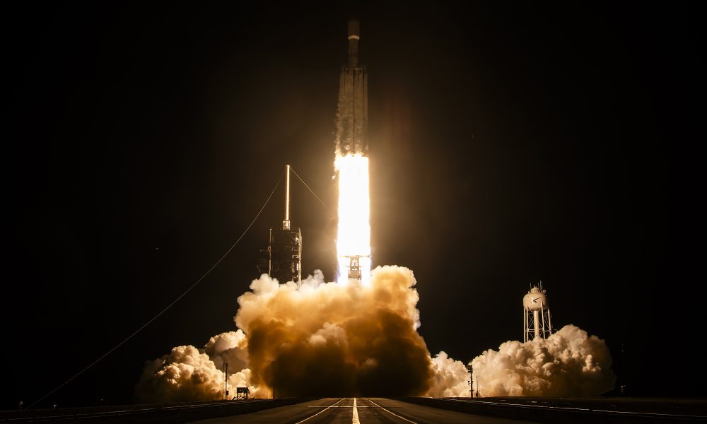 SpaceX's Falcon Heavy lifts off from Launch Complex 39A at NASA's Kennedy Space Center at 11:54 p.m. ET on October 1, 2026, carrying the classified NROL-97 mission for the National Reconnaissance Office. (Credit: SpaceX)