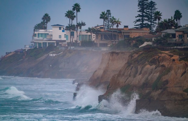 Coastal homes in Carlsbad during the high surf on Friday.  (Nelvin C. Cepeda / The San Diego Union-Tribune)