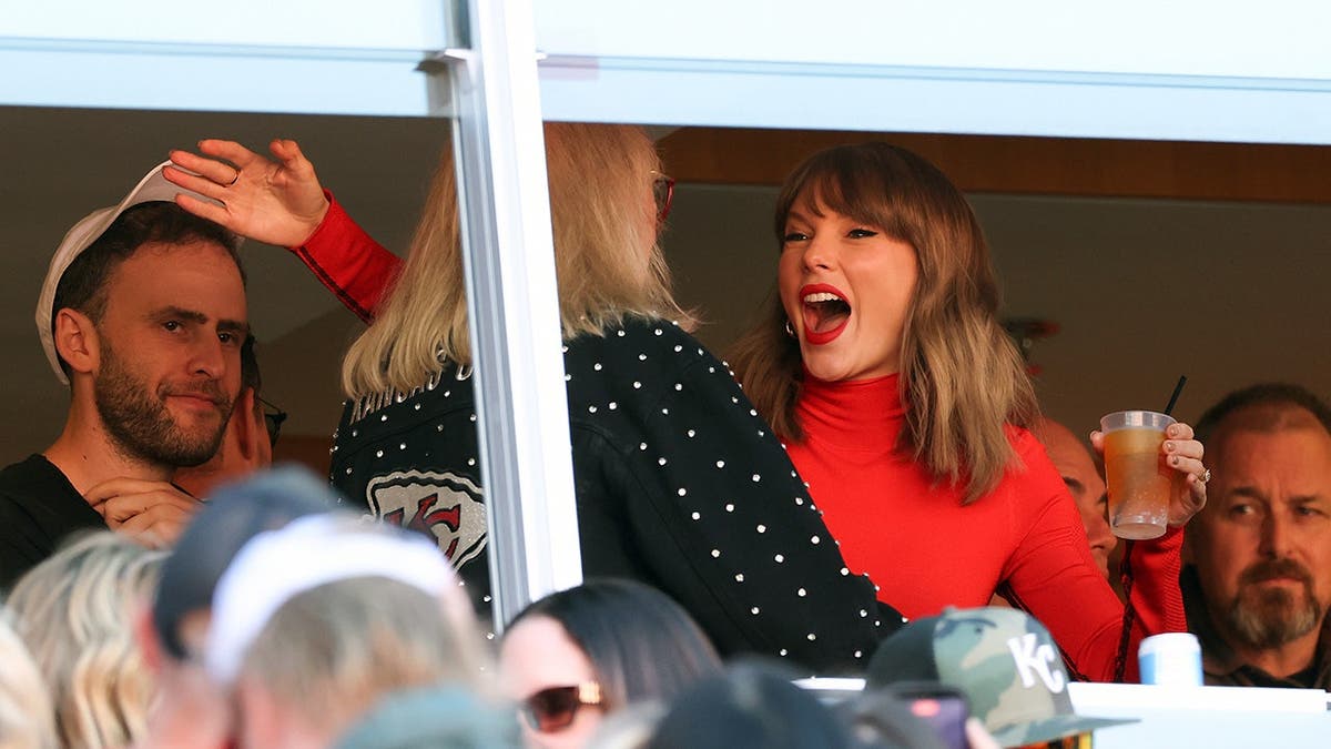 Taylor Swift hugs Donna Kelce during a football game at Arrowhead Stadium.