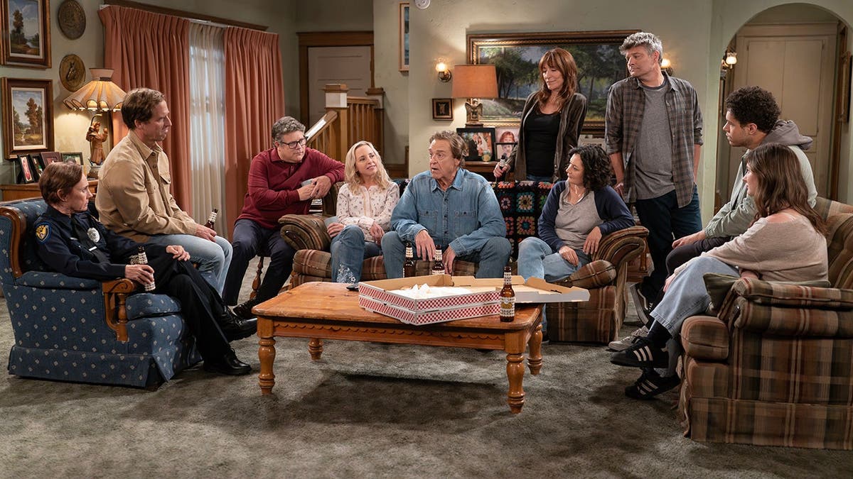Cast of The Conners pose together for a promotional portrait.