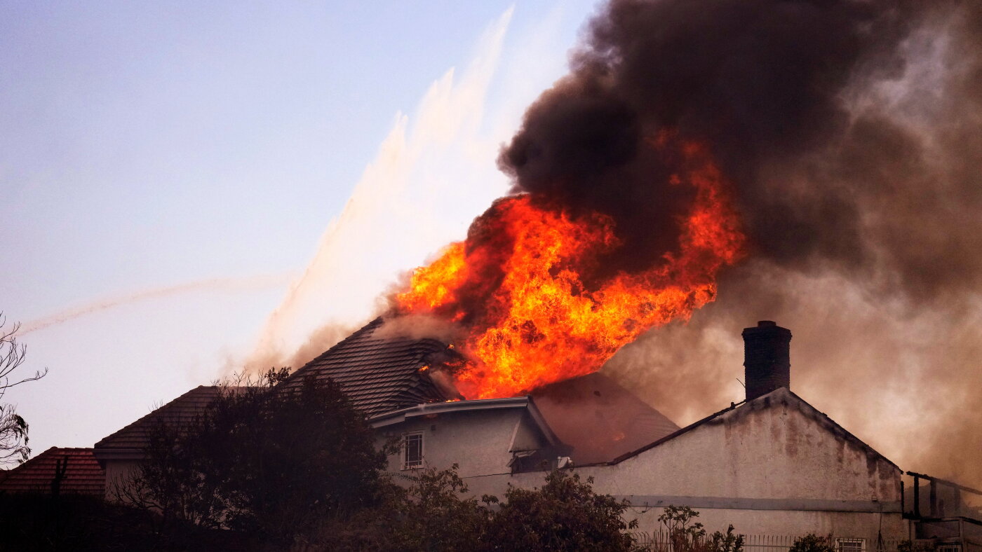 Coastal homes burn as hot winds fuel California fires : NPR