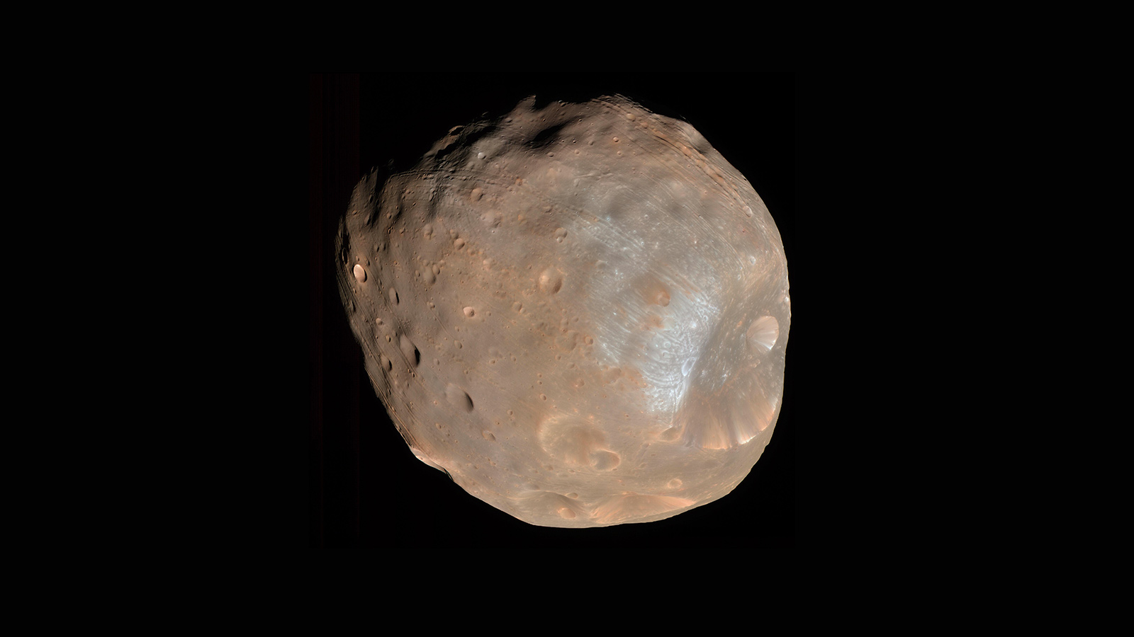 Phobos is the larger of Mars' two small moons and bears the scars of millennia of small impacts.