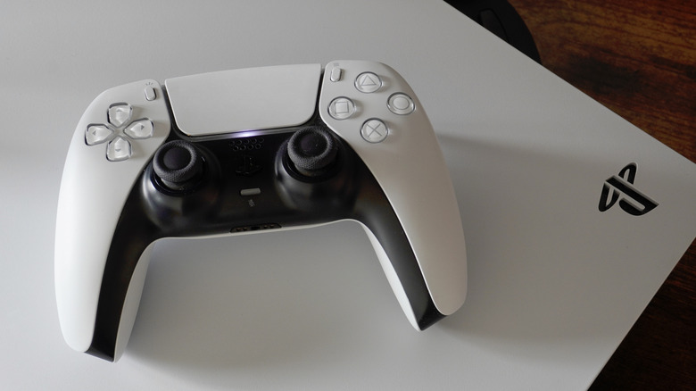 A PlayStation 5 console and controller.