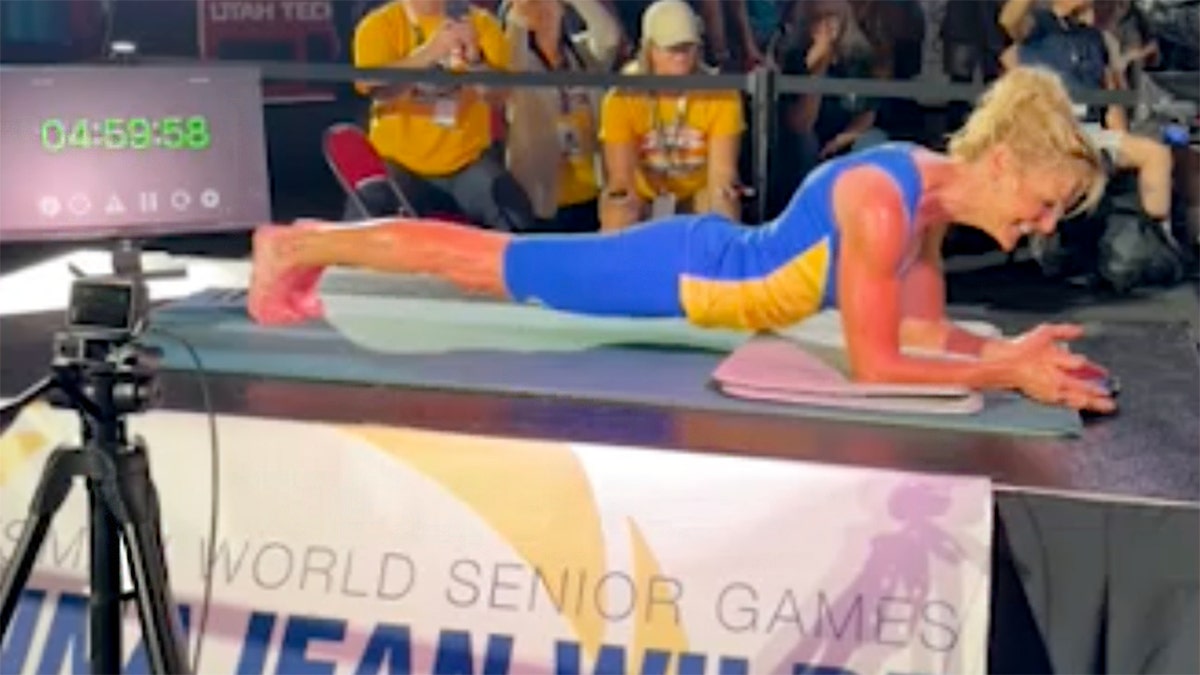 DonnaJean Wilde is in a plank at a competition.
