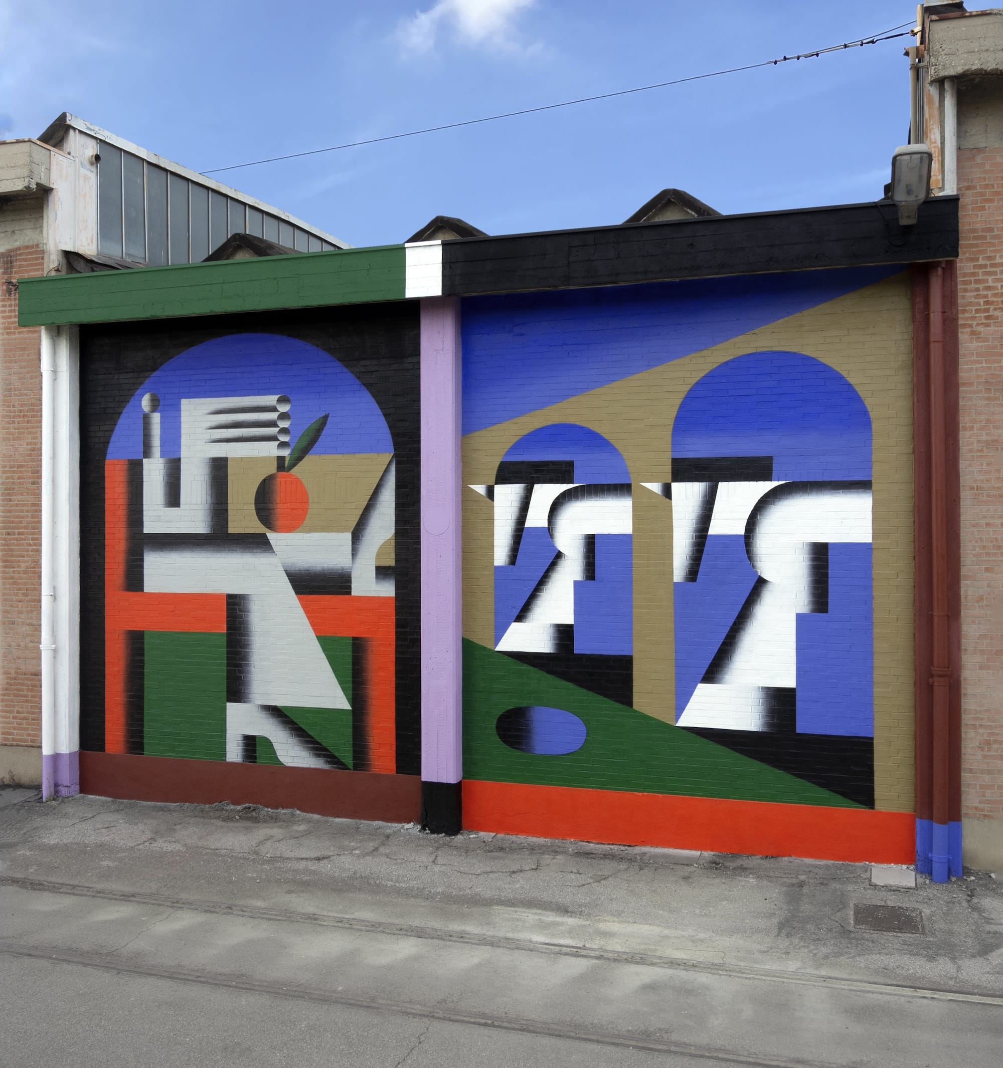 a colorful, geometric abstract mural on an urban wall