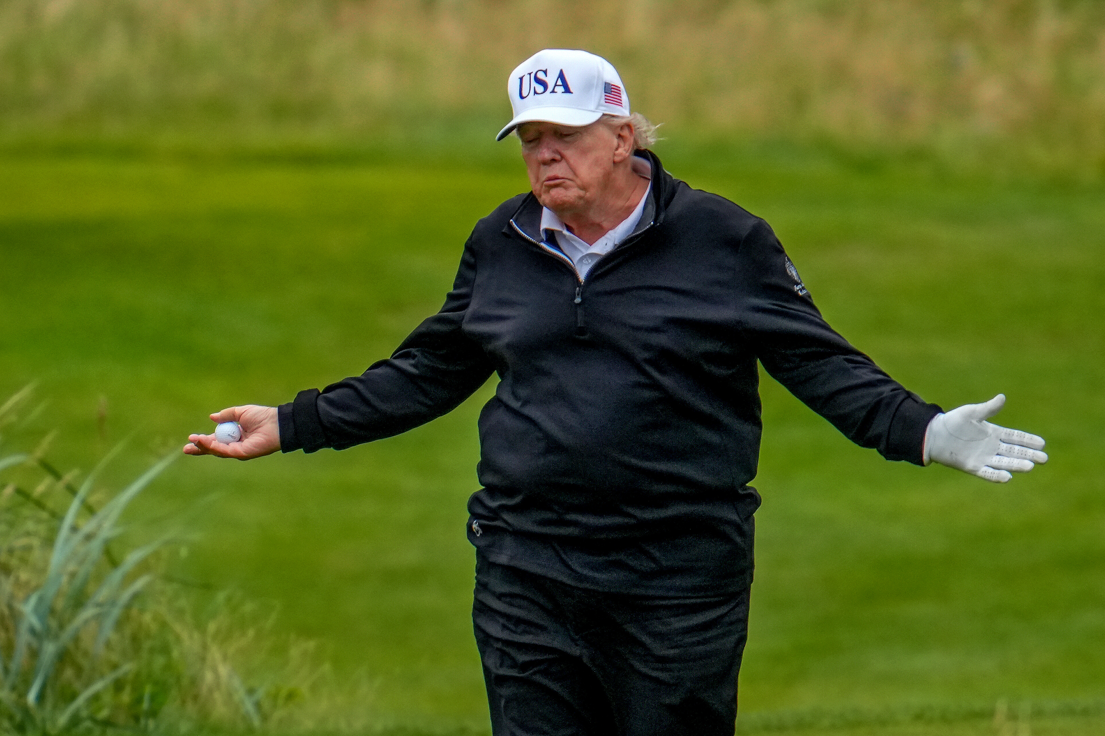 Donald Trump playing golf.