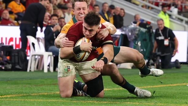 BRISBANE, AUSTRALIA - JULY 19: Dan Sheehan of British and Irish Lions goes over to score his team's 3rd try despite the efforts of Harry Potter of Australia during the 1st Test Match between Australia Wallabies and British & Irish Lions at Suncorp Stadium on July 19, 2025 in Brisbane, Australia. (Ph