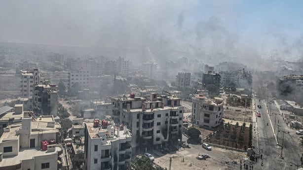 Smoke rises as clashes continue between Bedouin Arabs and some Druze armed groups in Sweida, Syria