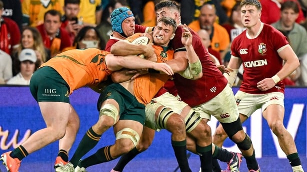 19 July 2025; Nick Champion de Crespigny of Australia is held up by British & Irish Lions players Tadhg Beirne and Dan Sheehan during the first test match between Australia and the British & Irish Lions at Suncorp Stadium in Brisbane, Australia. Photo by Brendan Moran/Sportsfile