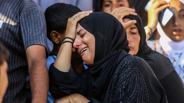 Palestinians mourn for their relatives killed in Israeli attacks in Khan Younis