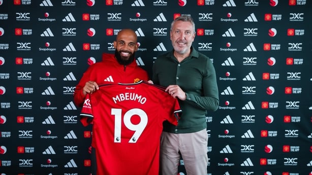 Bryan Mbeumo poses with Manchester United Director of Football Jason Wilcox