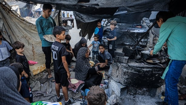 Palestinian children in a tent waiting for food in Yarmouk Camp in Gaza City