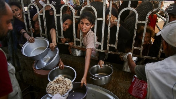 Hungry children in Gaza trying to access food
