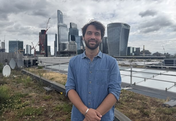 a person standing in front of a city