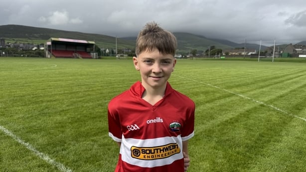 Shane O'Connor stands on a gaelic pitch.