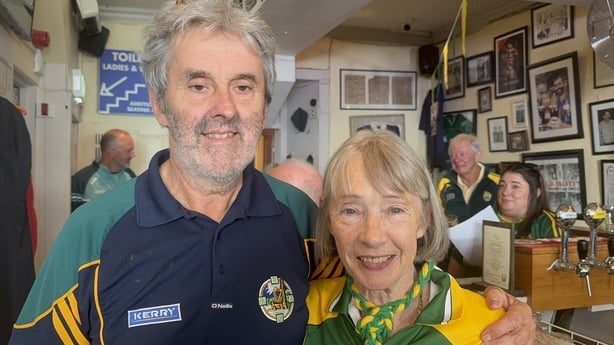 Declan and Breeda Falvey stand in a pub.