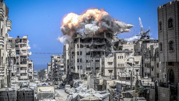 Smoke billowed from an area in Gaza during an attack where a school was heavily destroyed 