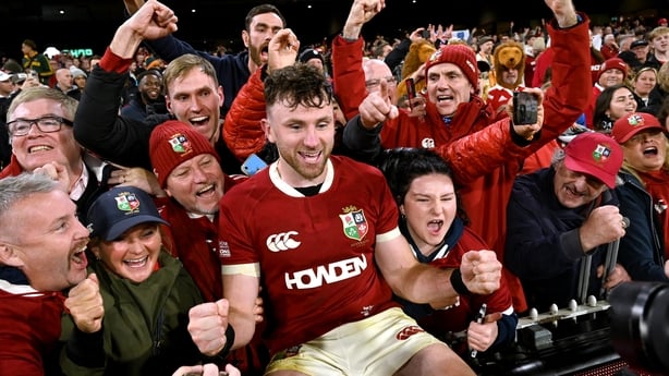 British and Irish Lions' Hugo Keenan (C) celebrates