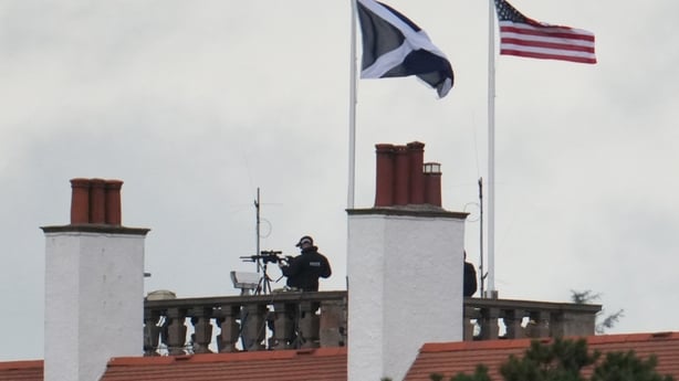 Police snipers are positioned on the roof of the Trump Turnberry hotel during US President Donald Trump's visit 