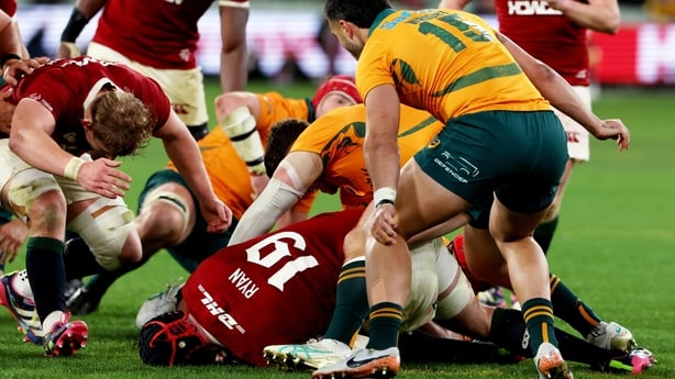 26 July 2025; Jac Morgan of British & Irish Lions, left, goes in to clear out Carlo Tizzano of Australia at a ruck in the lead up to the Lions fifth try, scored by Hugo Keenan, not pictured, during the second test match between Australia and the British & Irish Lions at the Melbourne Cricket Ground 