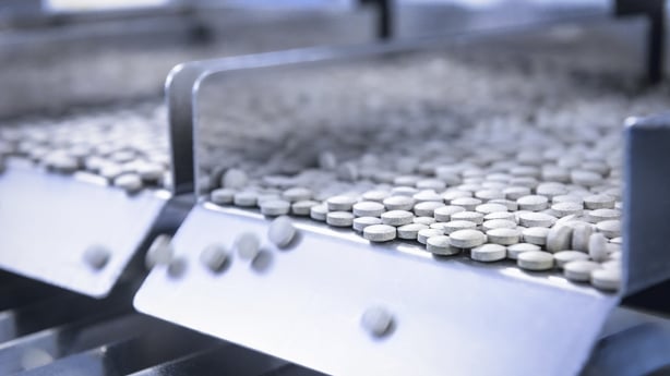 a close-up of a machine with pills