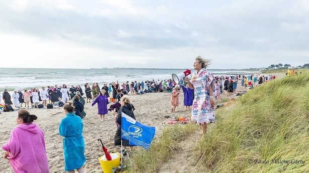 a group of people on a beach