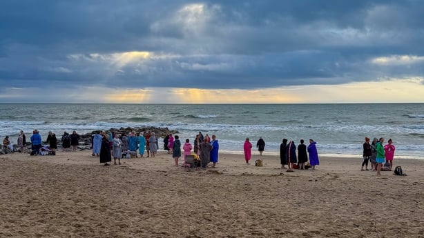 a group of people on a beach