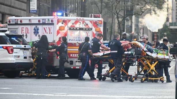 A group of people carrying a stretcher