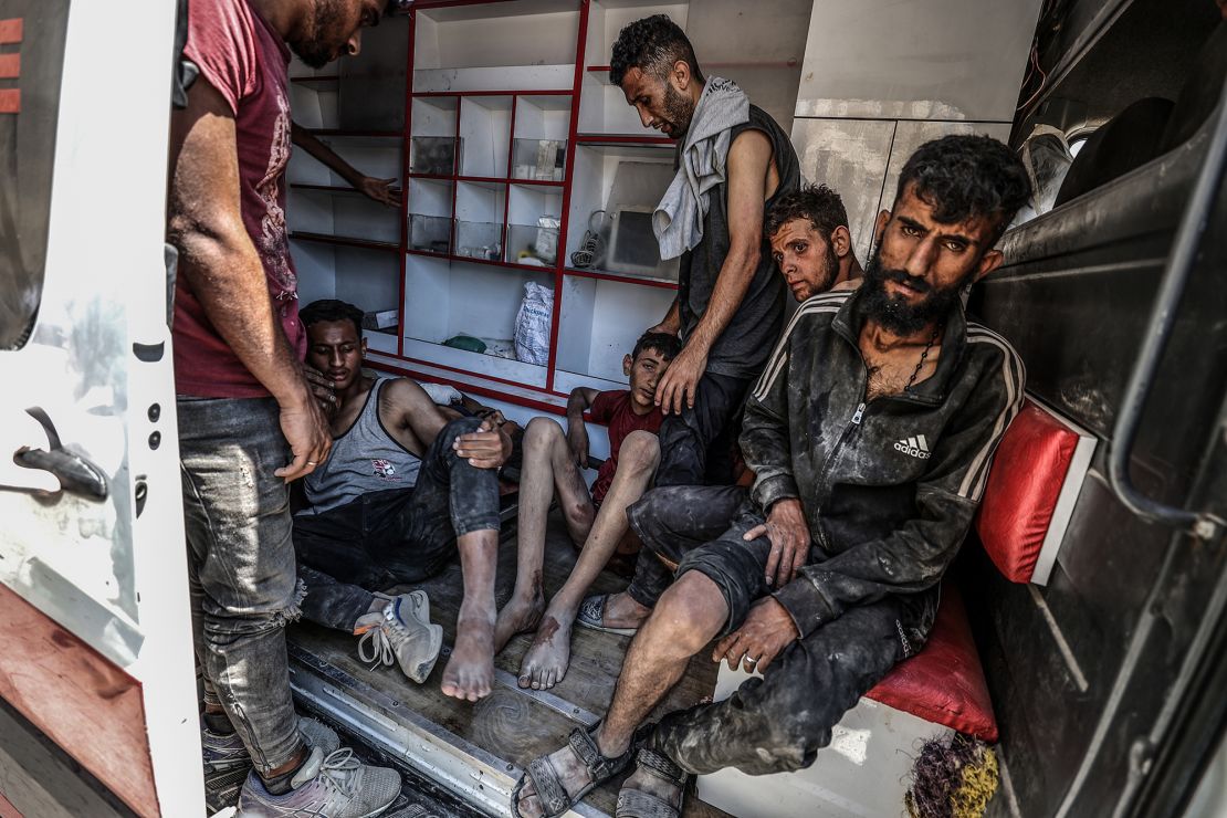 Injured Palestinians are transported to hospitals after Israeli forces open fire on civilians waiting for humanitarian aid in the Zikim area on Sunday.