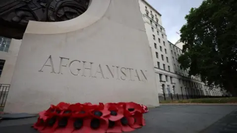 EPA A monument inscribed with the word Afghanistan outside the headquarters of the Ministry of Defence in London