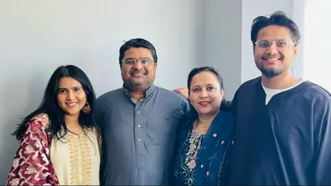 Inayat Syed, 49, with his wife Nafeesa, along with their son and daughter