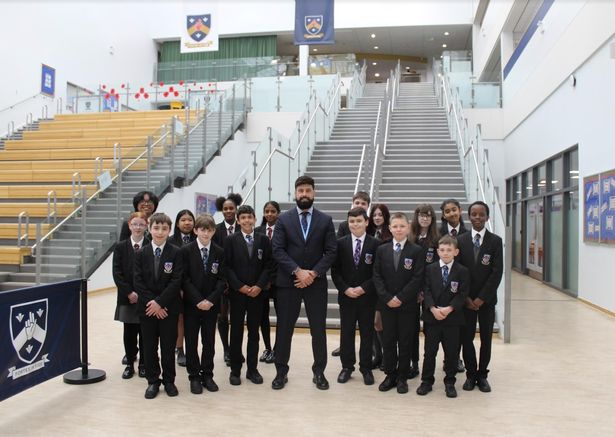 St Edmund Arrowsmith headteacher Lee Peachey (centre) is currently away from his role 