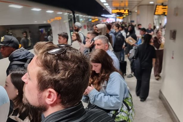 Rail passengers crowd on the platform as disruption continues