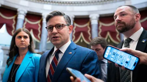 Getty Images US House Speaker Mike Johnson, a Republican from Louisiana, speaks to members of the media while walking to the House Chamber during a vote at the US Capitol in Washington, DC, US, on Thursday, July 17, 2025. 
