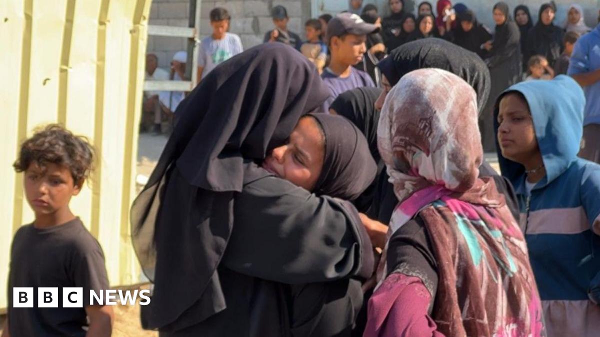 Mary Sheikh al-Eid's family is comforted after her body is brought to Nasser Hospital in Khan Younis, southern Gaza (24 July 2025)