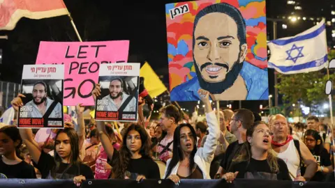 Reuters Israeli hostages' families and their supporters take part in a rally to demand a deal securing their release from captivity in Gaza, in Tel Aviv, Israel (5 July 2025)