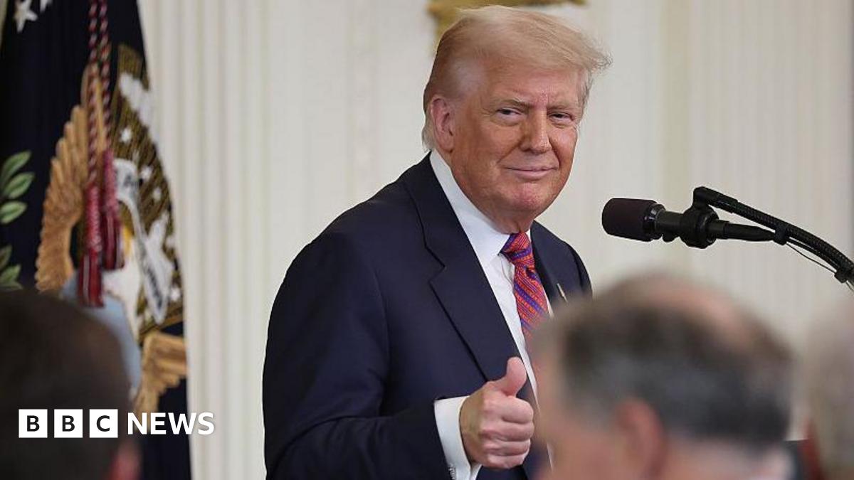 Trump gives a thumbs up at a bill signing ceremony on Friday.