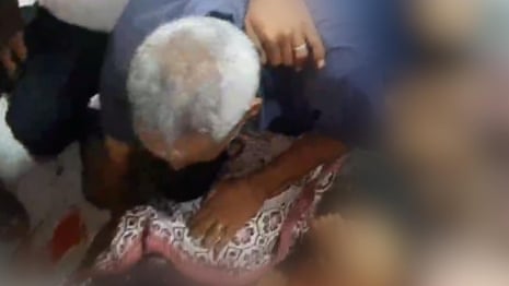 Father grieves over bodies of children killed in airstrike - video