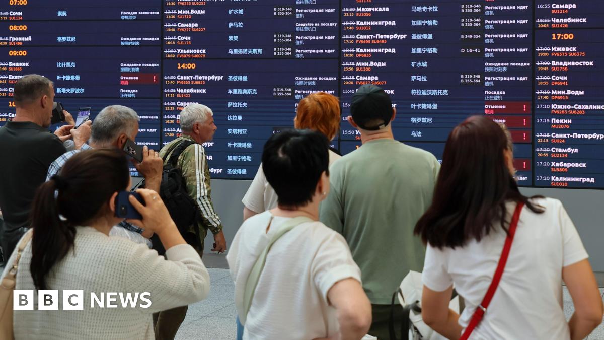 Passengers examine departure table waiting their flights at Sheremetyevo International Airport outside Moscow, Russia, 07 July 2025.